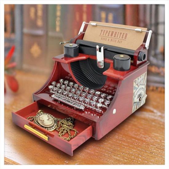 Music box with typewriter figure.