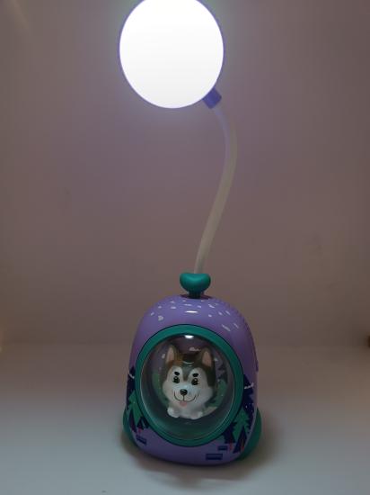 Table lamp with changing color dog.