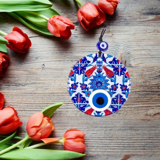 Decorative evil eye bead with tile and tulip patterns.